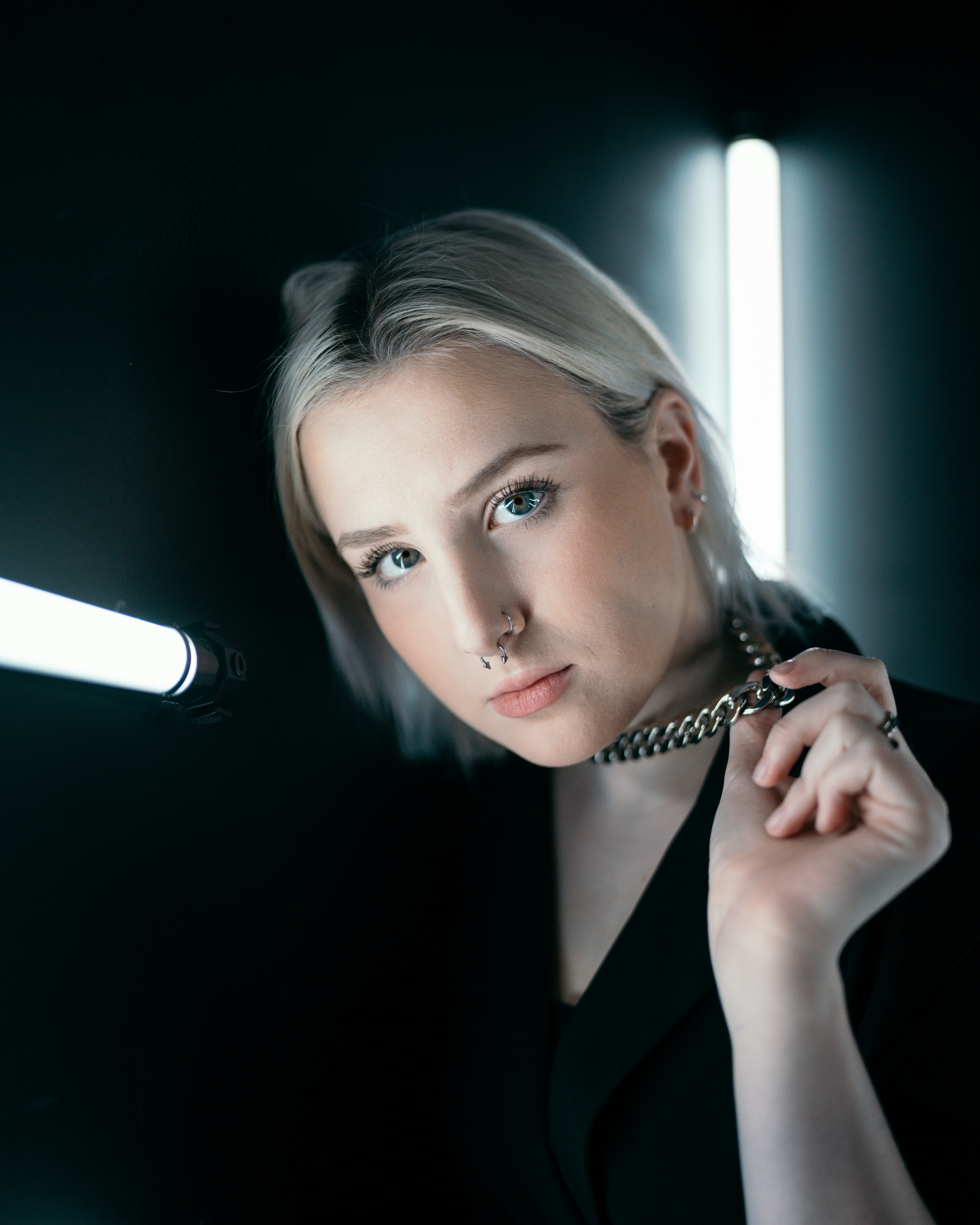 woman in black blazer holding microphone